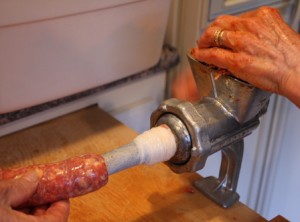 Stuffing-seasoned-meat-into-casing-Piemonte-Sausage